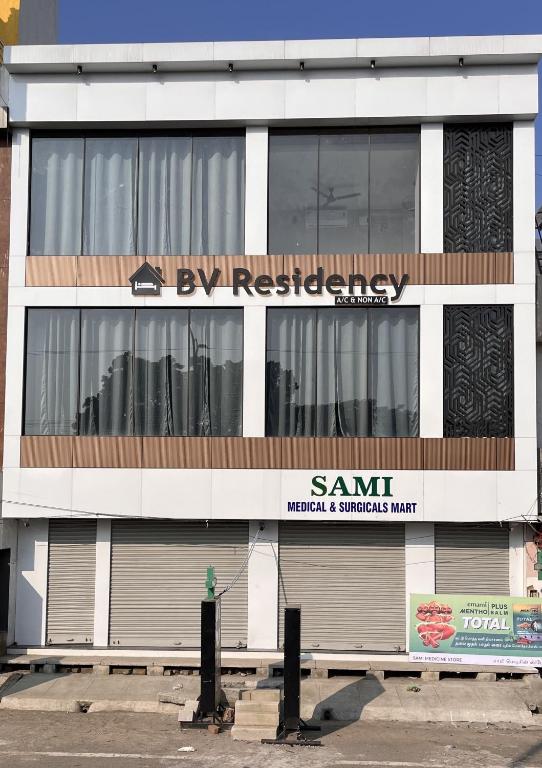 a building with a sign on the side of it at BV Residency in Pondicherry