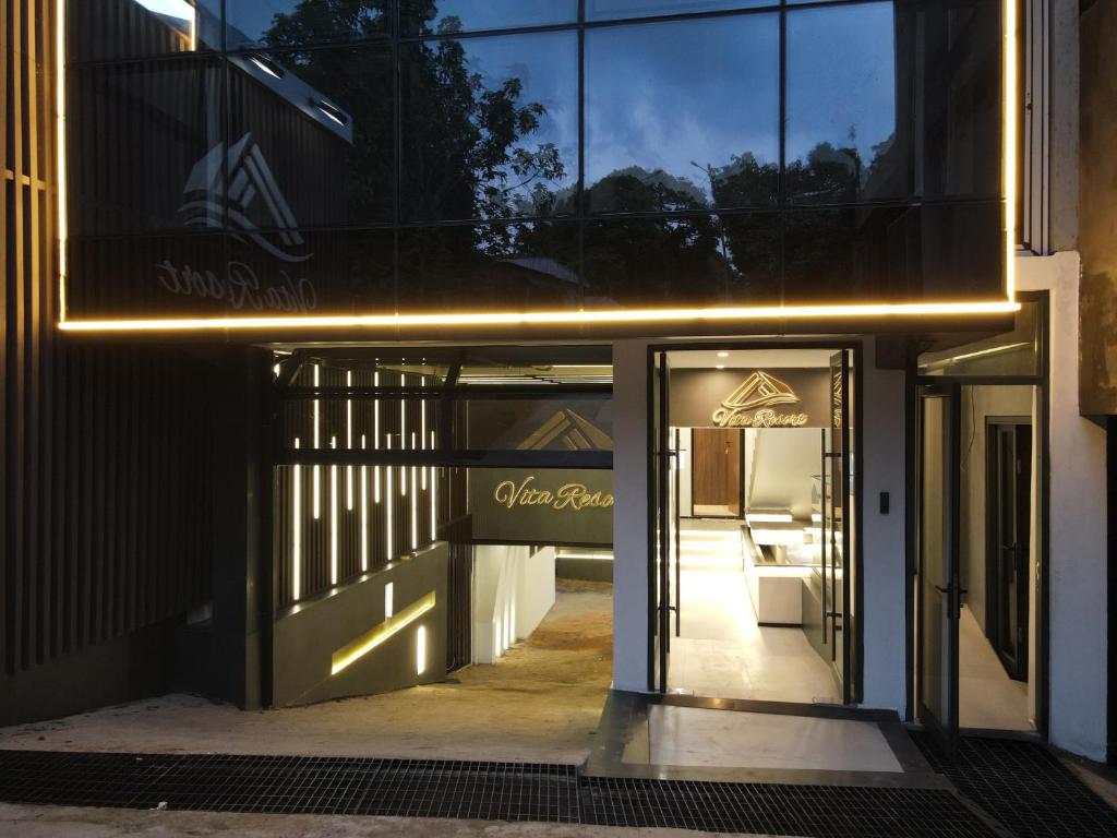 a store front with lights on the door at Vita Resort Golf Bastos in Yaoundé