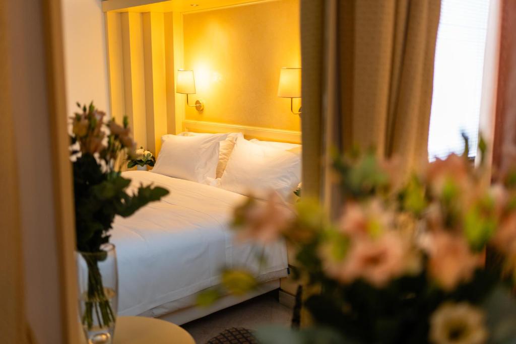 En eller flere senge i et værelse på Hotel Giudecca Venezia