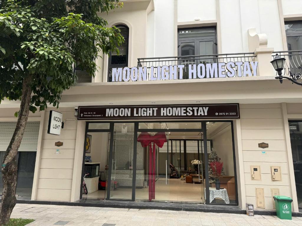 a store front of a house with a sign on it at MoonLight Homestay in Hòa Bình