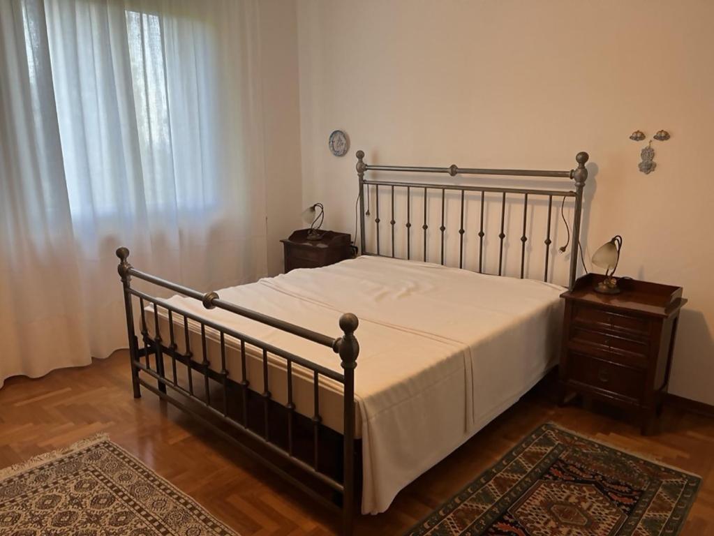 En eller flere senge i et værelse på Villa ELISA - appartamento nel cuore del Chianti