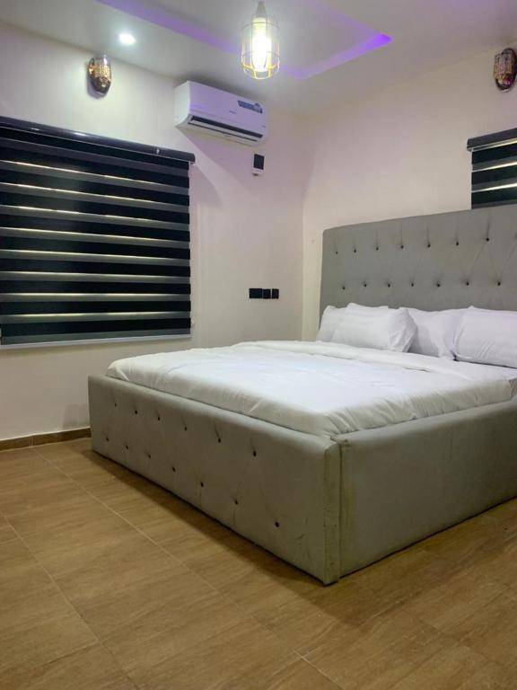 En eller flere senge i et værelse på Luz Haven Apartment