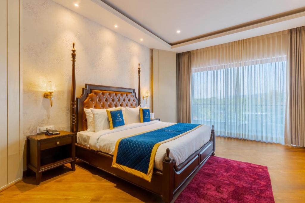 Giường trong phòng chung tại Soni Arena Hotel