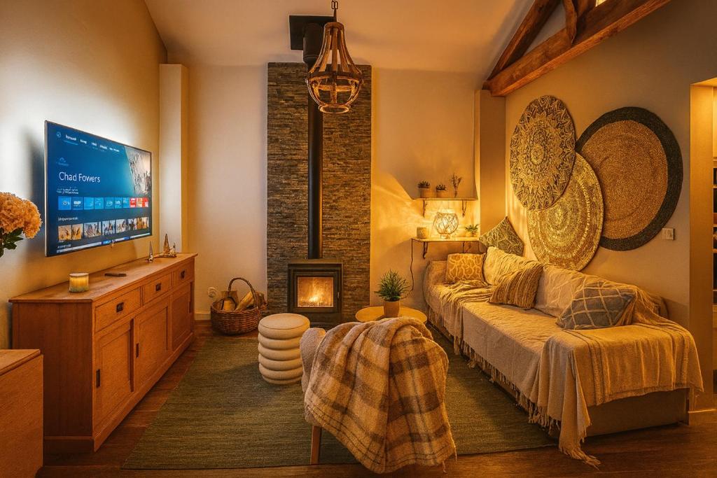 a bedroom with a bed and a tv in it at Evergreen -Ocean and Spa- in Parentis-en-Born