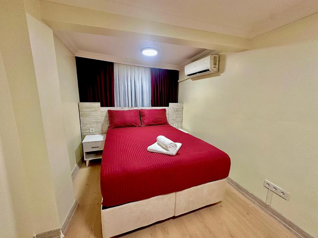 Giường trong phòng chung tại Golden Taksim Kent Apart Hotel
