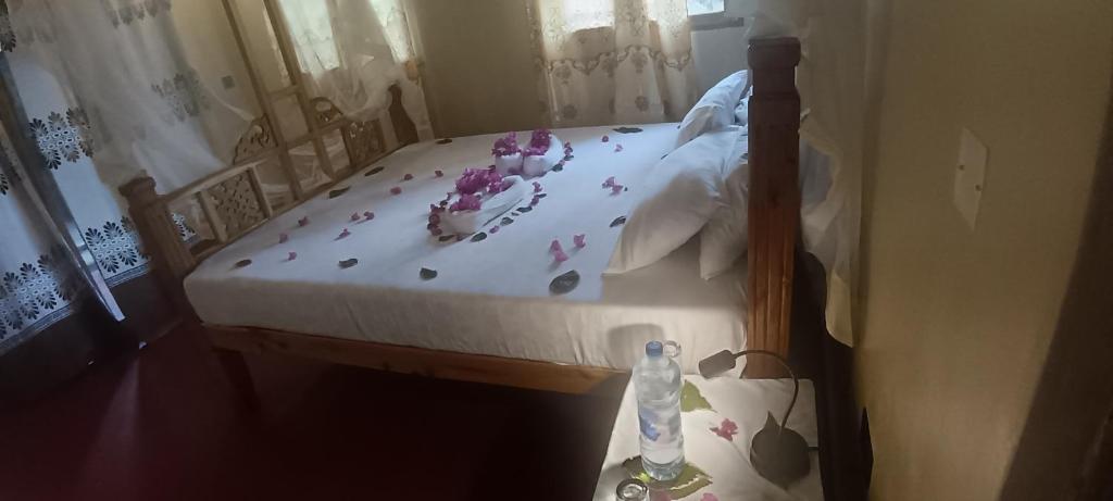 En eller flere senge i et værelse på Kua Garden Bungalow