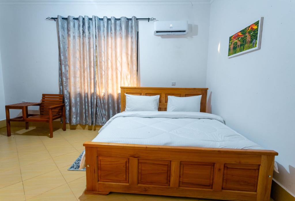 Giường trong phòng chung tại Siarick Cottages