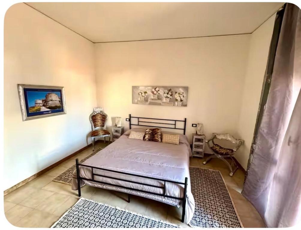 En eller flere senge i et værelse på Affittacameredamari