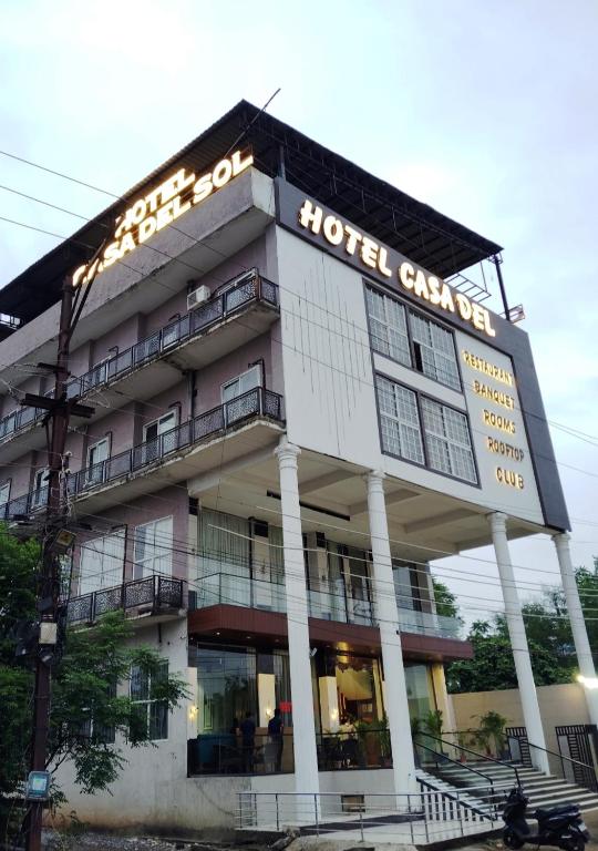 a hotel building with a sign on top of it at Hotel Casa Del Sol in Raipur