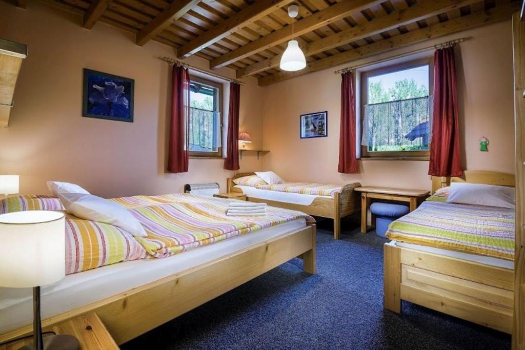 Ένα ή περισσότερα κρεβάτια σε δωμάτιο στο KAPINA sk - Holiday Homes