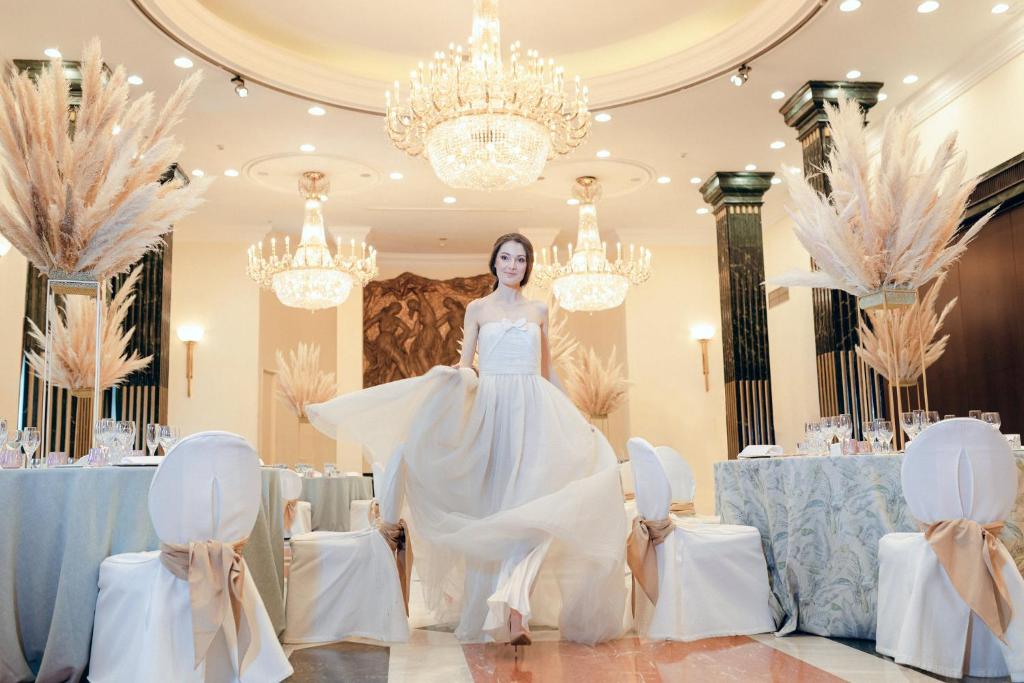 a woman in a wedding dress in a room with tables at InterContinental Madrid by IHG in Madrid