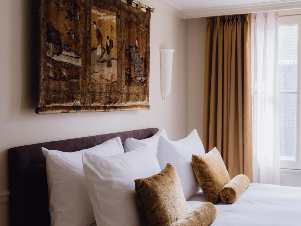 Postel nebo postele na pokoji v ubytování L'Opale Noire