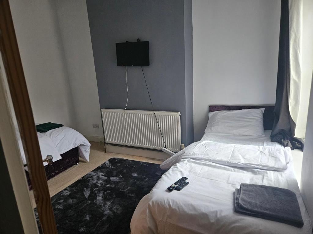 En eller flere senge i et værelse på Comfort and Leisure