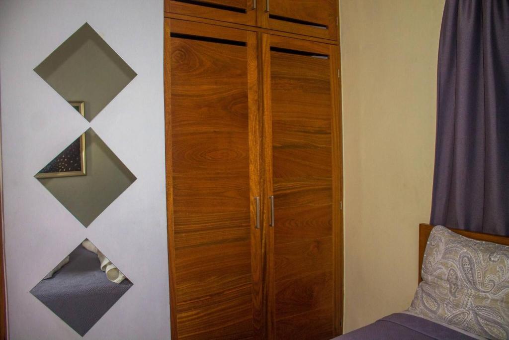 Postel nebo postele na pokoji v ubytování City Sea Exclusive Colonial Gem with Ocean View