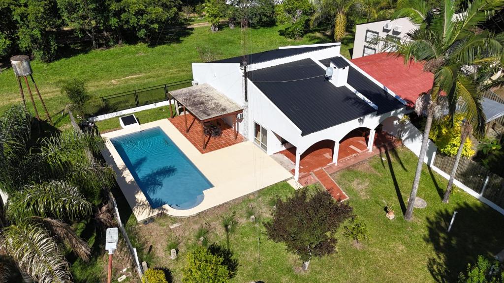 an overhead view of a house with a swimming pool at Casa Lago in Santa Ana