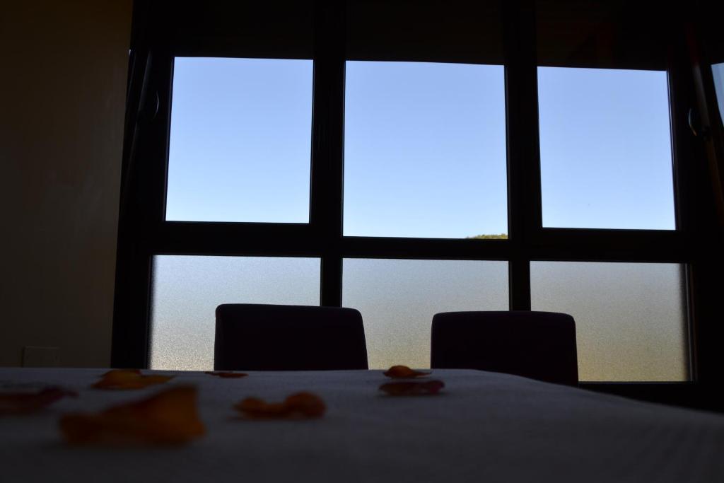 A bed or beds in a room at Hotel Rural Pescadores