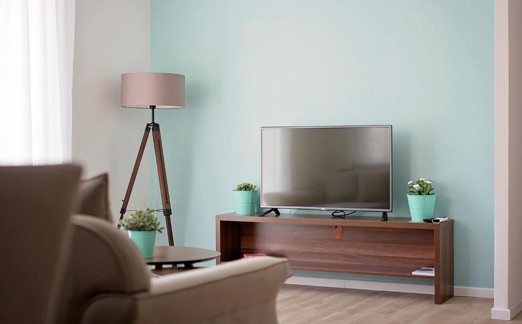 TV a/nebo společenská místnost v ubytování Enjoy Apartments