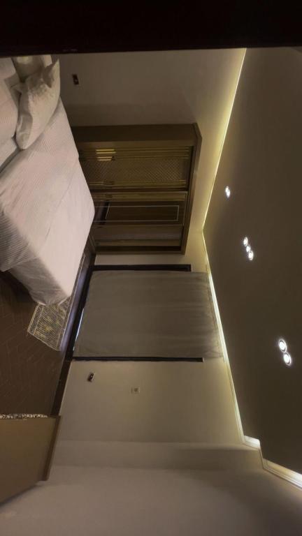 En eller flere senge i et værelse på الشيخ زايد شارع عمار ابن ياسر