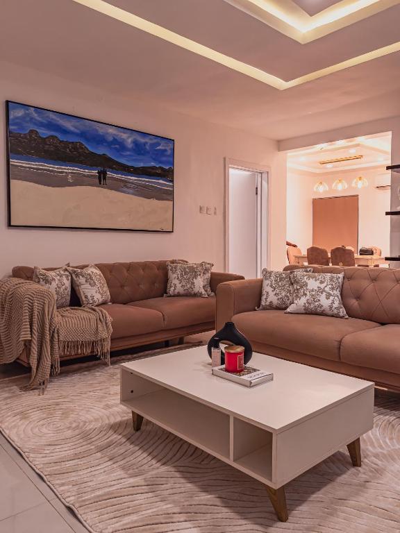 a living room with a couch and a coffee table at Virginia Apartments in Addo