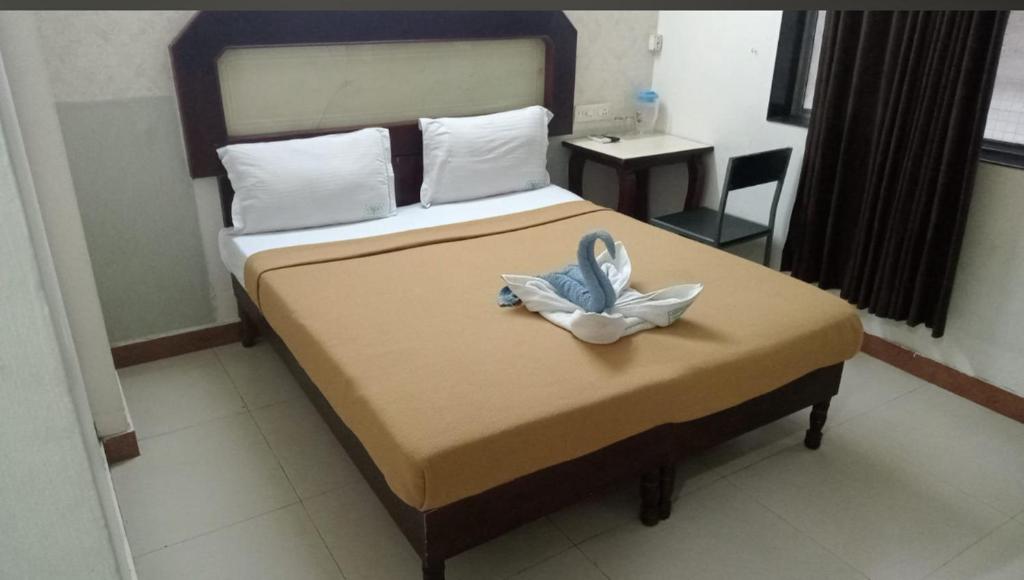 En eller flere senge i et værelse på Prakruthi home stay