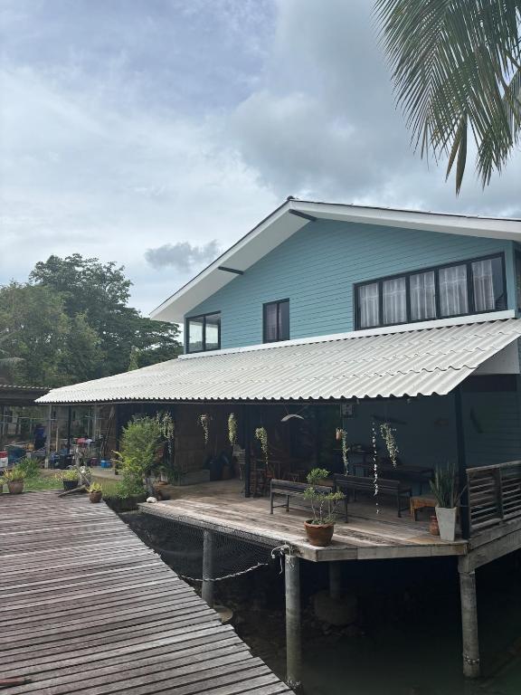 a house on the water with a dock at Sea view house, swimming pool in Ko Chang
