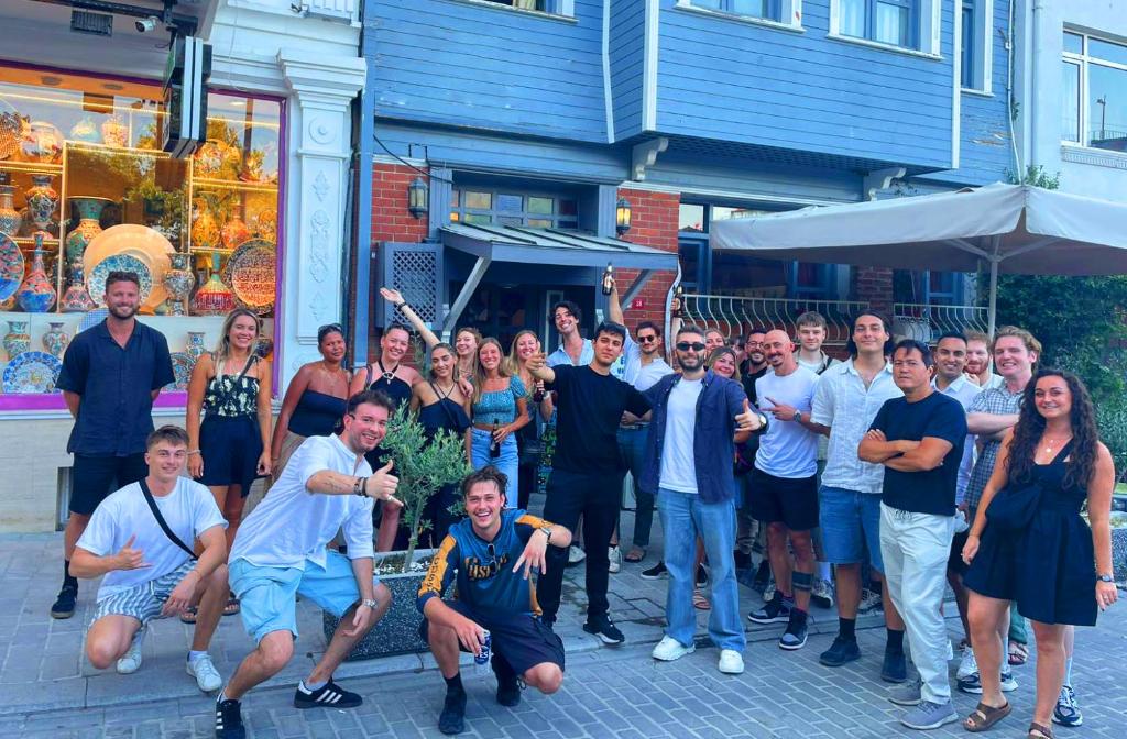 a group of people standing in front of a building at Cheers Vintage Hostel in Istanbul