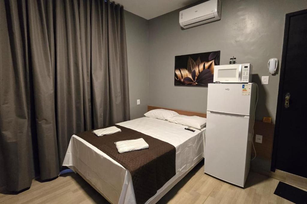 Ένα ή περισσότερα κρεβάτια σε δωμάτιο στο FLATS MELO unimontes