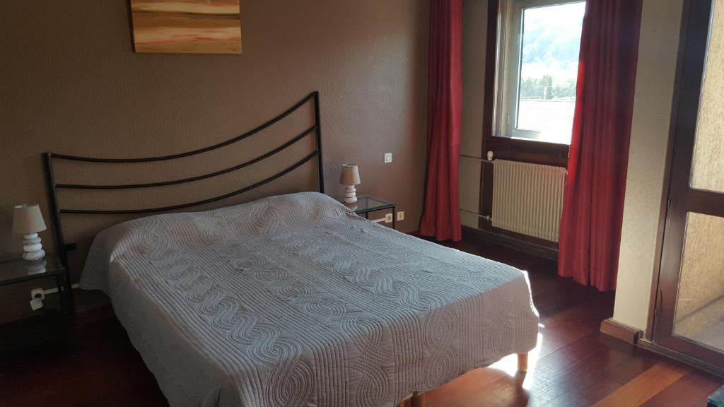 Postel nebo postele na pokoji v ubytování Hotel De La Gare