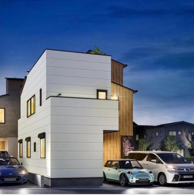 two cars parked in front of a white building at Tokyo Hoshino House 1Floor in Tokyo
