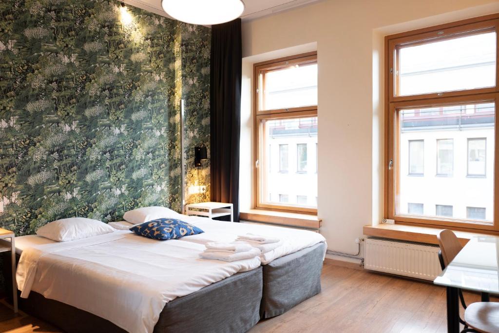 Postel nebo postele na pokoji v ubytování Hotel Finn