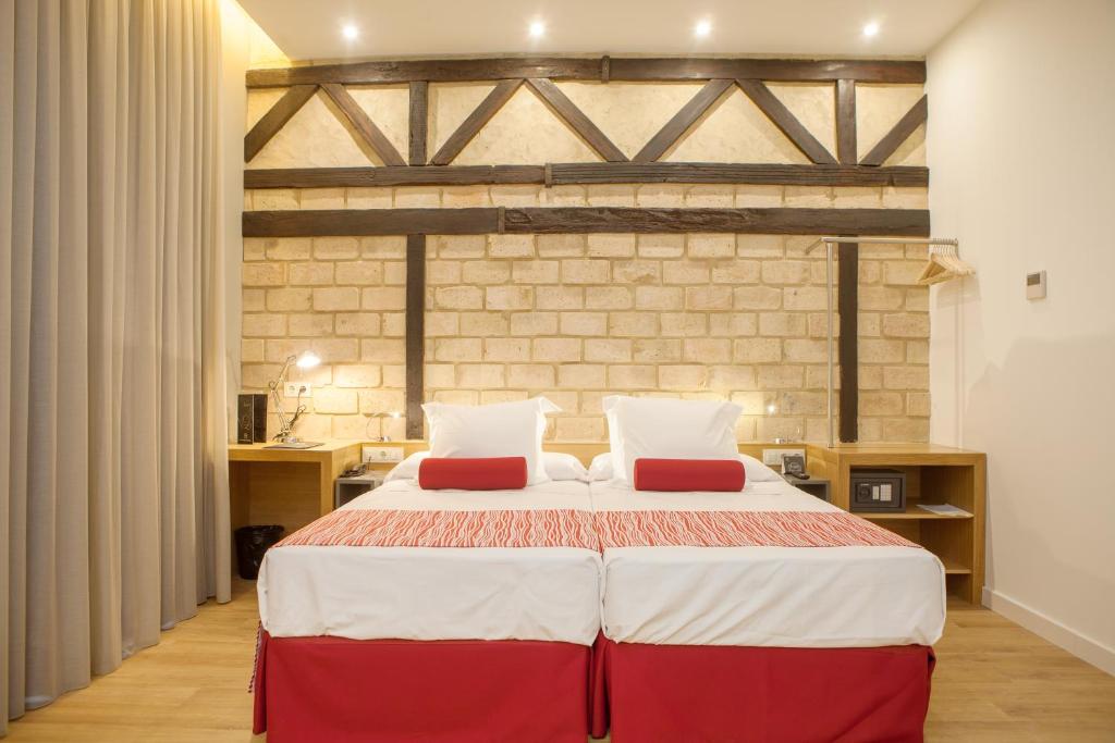 Postel nebo postele na pokoji v ubytování Soho Boutique Capuchinos & Spa