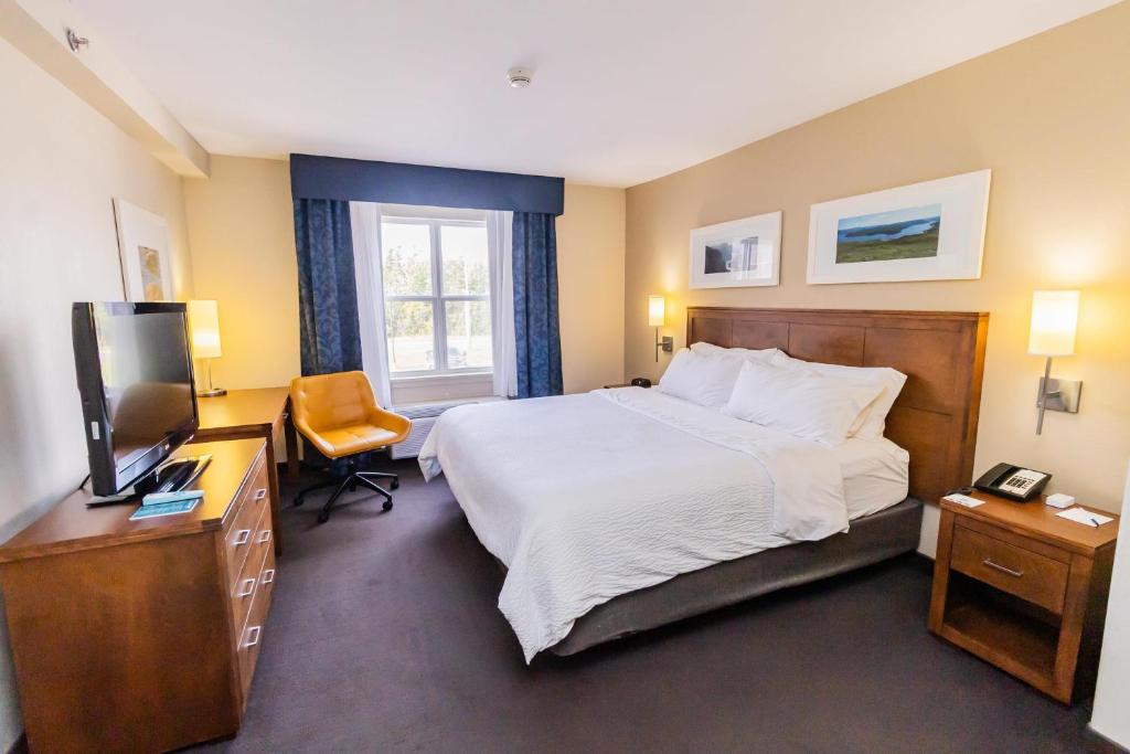 En eller flere senge i et værelse på Deer Lake Horizon Hotel, BW Signature Collection