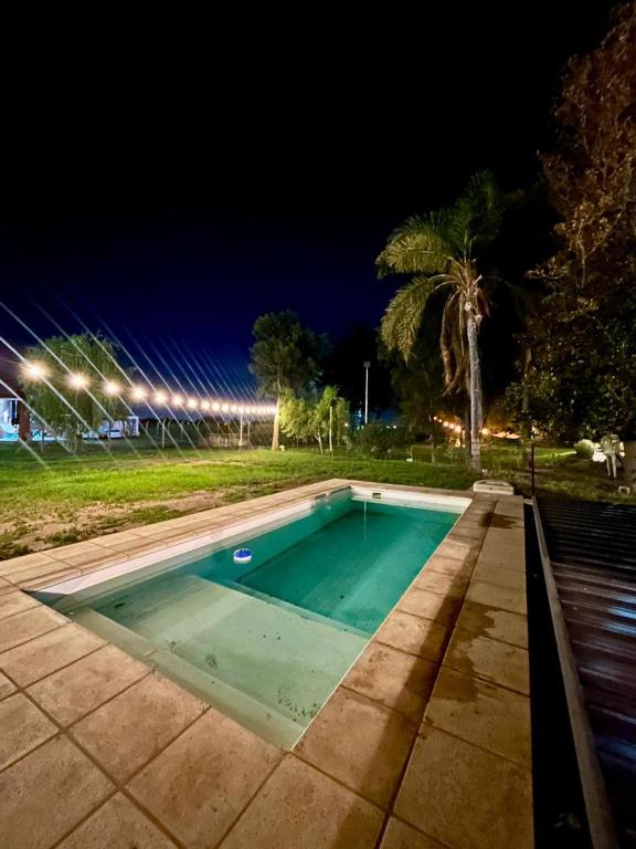 a swimming pool in a park at night at La Remigia in San Juan