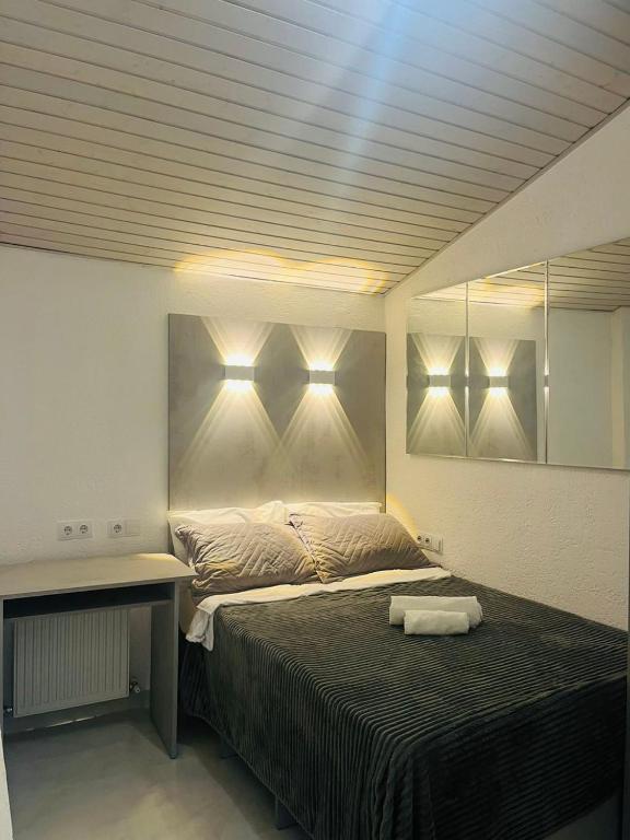 Postel nebo postele na pokoji v ubytování Studio Bucuresti-Centru