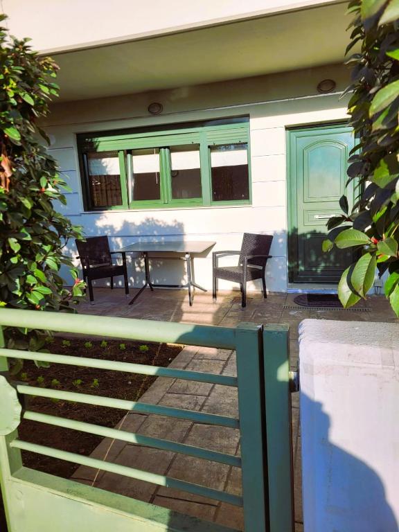 a house with a patio with a table and chairs at Despina's house in Ioannina