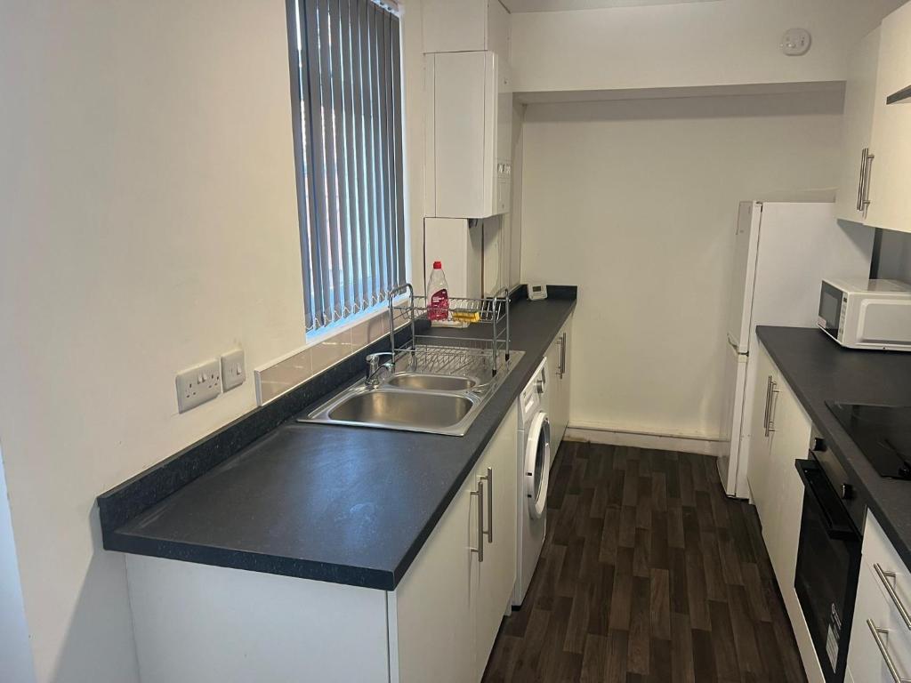 Køkken eller tekøkken på Cosy 4 bed House