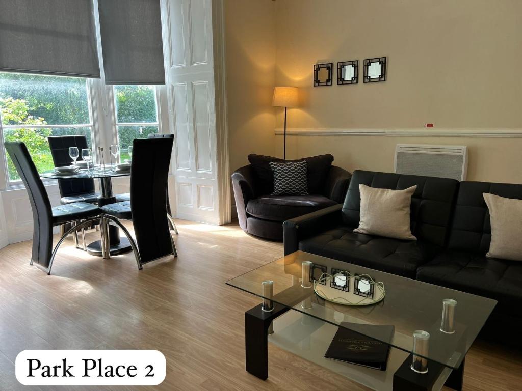 a living room with a couch and a table at Park Place Apartments in Sunderland