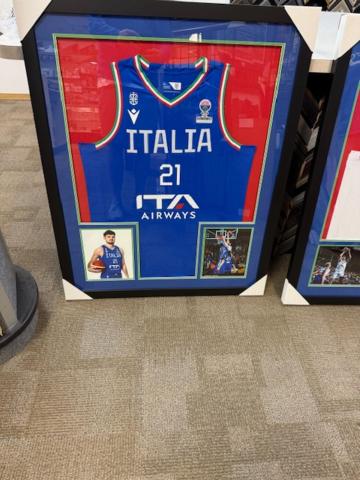 a picture of a basketball jersey in a box at Basillican in Cape Coral