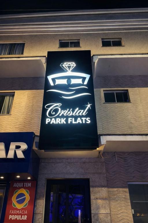 a sign on the side of a building at Cristal park flats in Cristalina