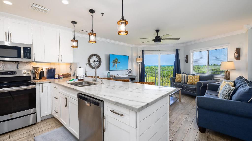 a kitchen and living room with a large counter top at Saltair Loft Ocean Pointe 2 BR 2 BA 1411 in Tavernier
