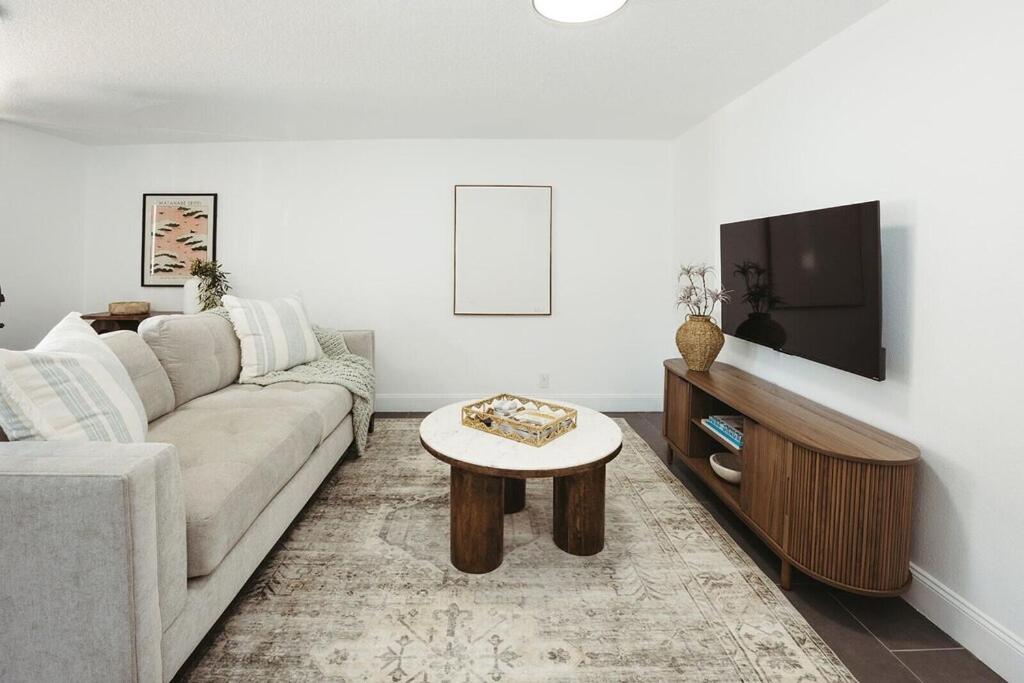 a living room with a couch and a coffee table at Beachside Bliss - Beach House Unit 2 in Jacksonville Beach
