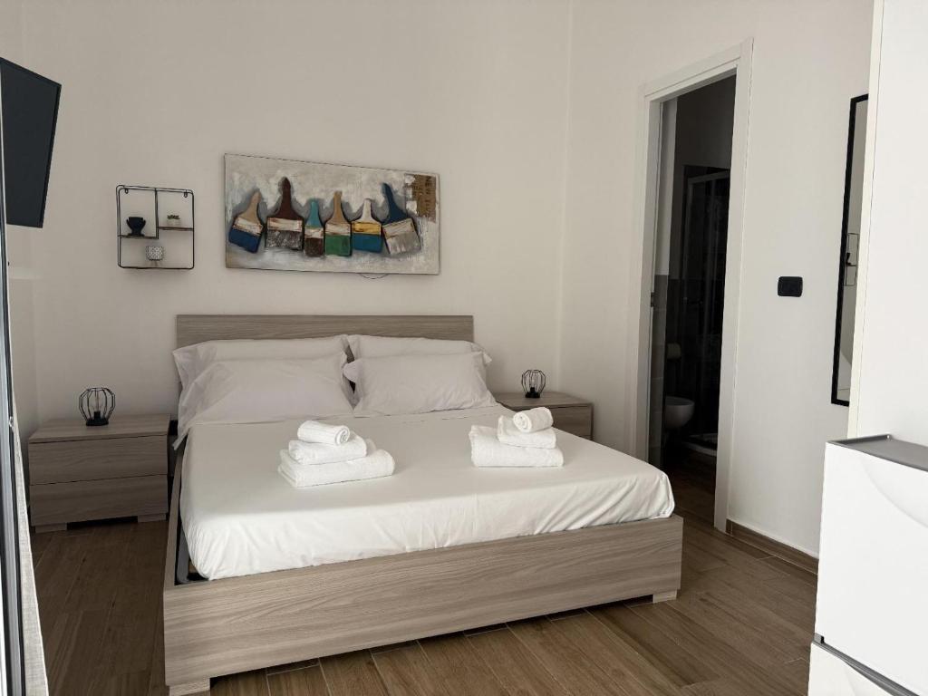 Postel nebo postele na pokoji v ubytování Amarvi'