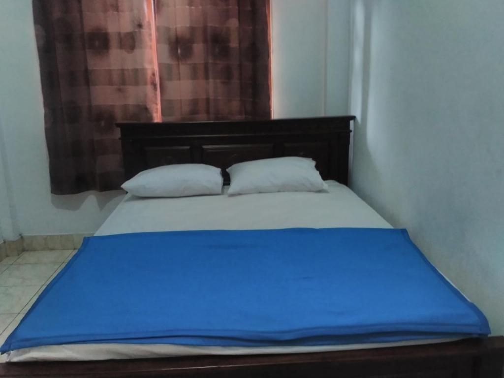 Postel nebo postele na pokoji v ubytování Ratih Bali Hostel