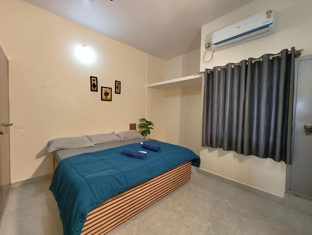 Ένα ή περισσότερα κρεβάτια σε δωμάτιο στο Galaxy Homestay Mysore 4bhk - Family friendly