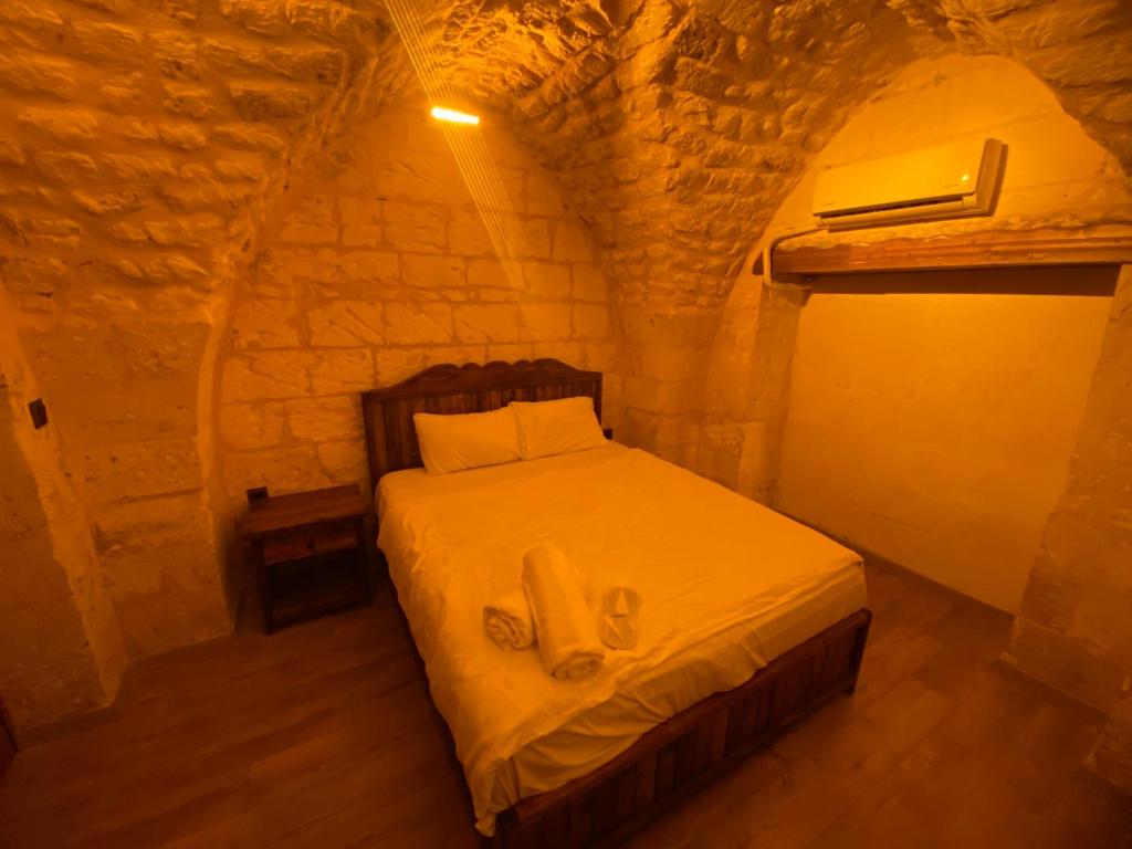 En eller flere senge i et værelse på Ayataç Konak Otel