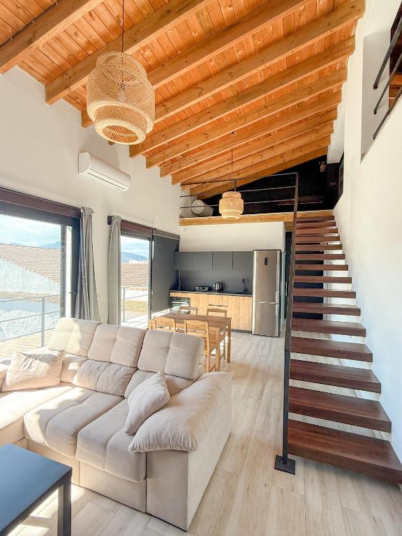 a living room with a couch and a table at Apartamentos Algodonales in Algodonales