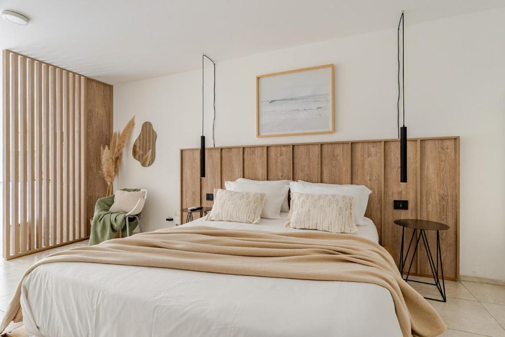 Giường trong phòng chung tại Departamentos Lugar