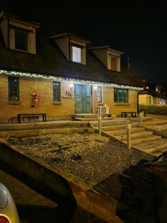 a house with a wooden fence in front of it at Toarp Inn free parking in Malmö
