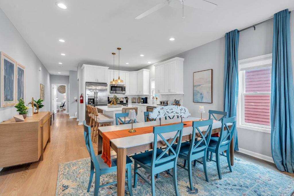a kitchen and dining room with a table and chairs at 127 Fremont in Seaside Heights