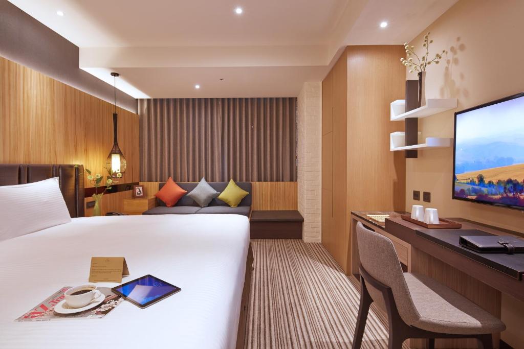 Postel nebo postele na pokoji v ubytování La Vida Hotel